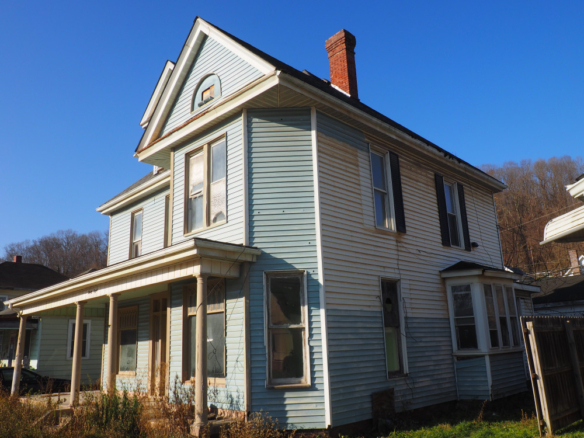 38 Main Street, Glouster, Ohio 45732 large blue Victorian style house